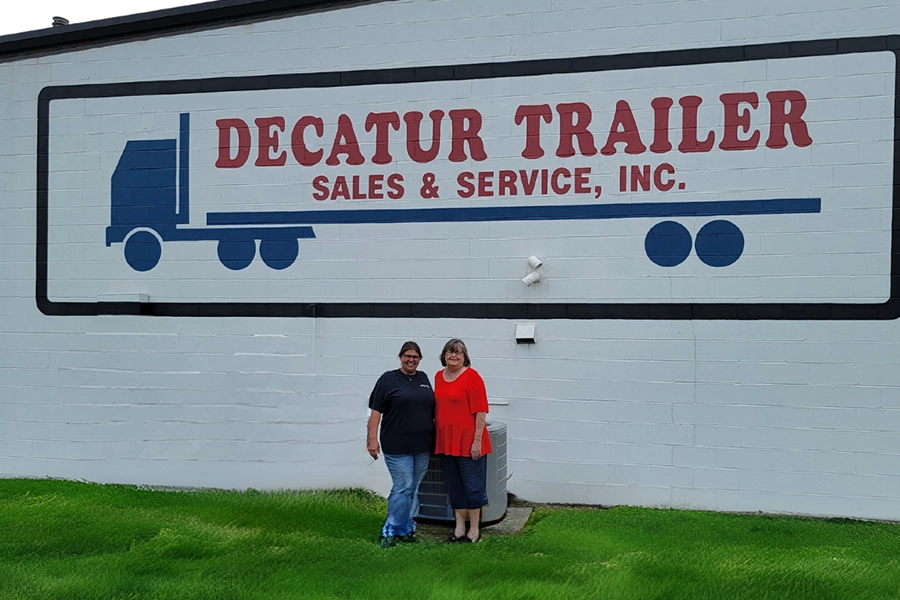 Mother and Daughter standing in front of Decatur Trailer Sales & Service Inc. Decatur, IL