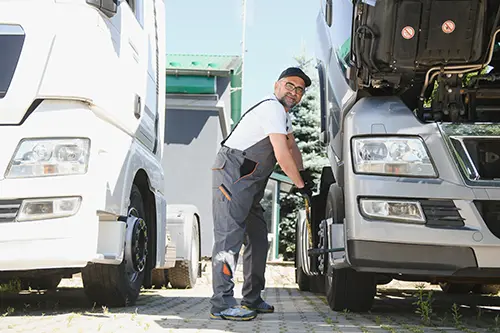 Decatur Trailer Sales & Service—A professional mechanic administers repairs to semi-trucks in Springfield, IL.