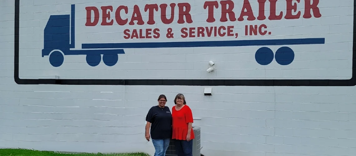 Mother and Daughter standing in front of Decatur Trailer Sales & Service Inc. Decatur, IL