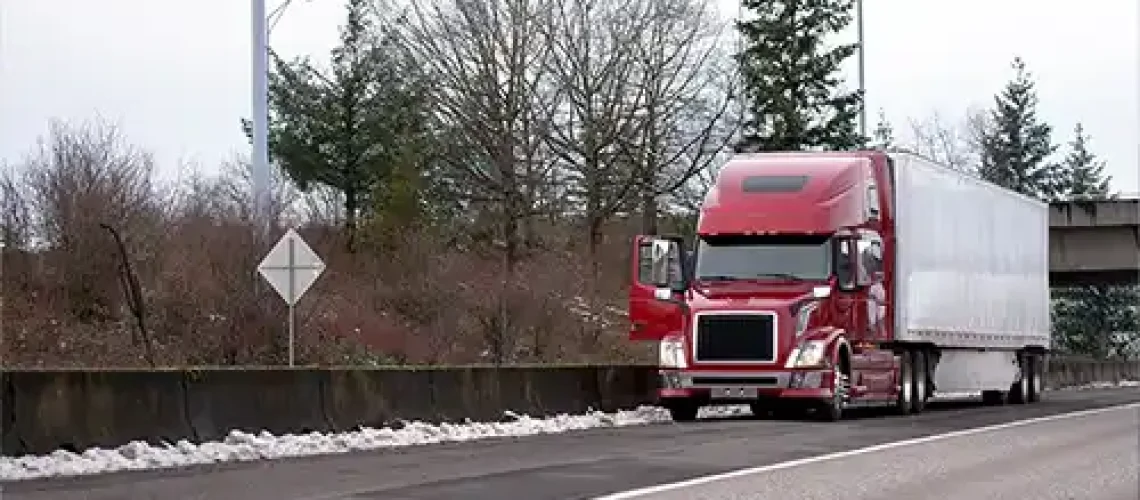 Decatur Trailer Sales & Service - A semi-truck driver is dealing with an emergency breakdown situation and pulls over on the highway in Decatur, IL.