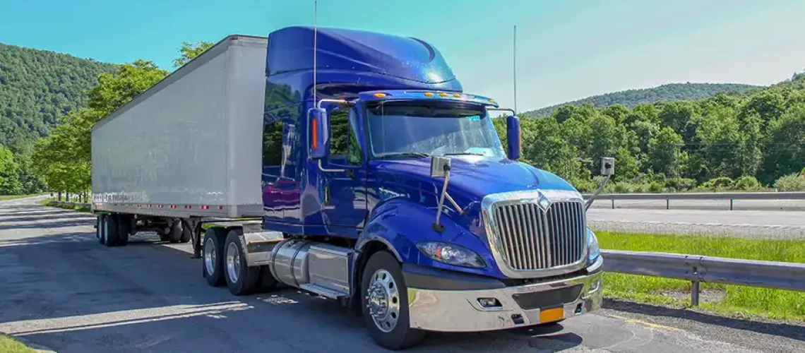 decaturtruck-trailer-2024-2025-blog-image-2025-07-15-RESIZED Decatur Trailer Sales & Service—A blue and white semi-truck on a highway in Decatur, Il, preparing for a long haul.